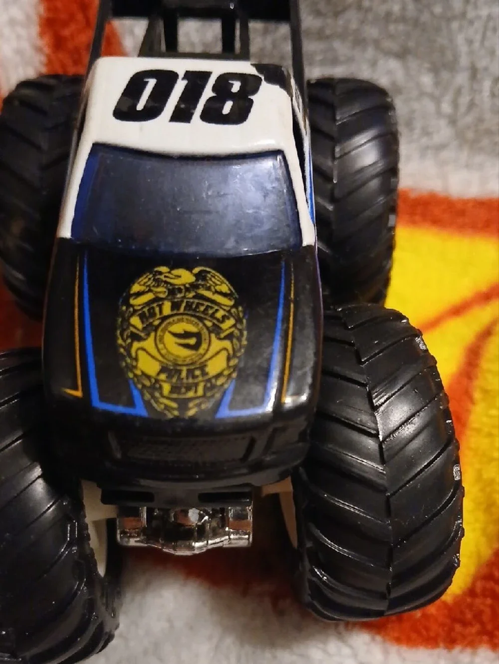 Police Hot Wheels Monster Truck Toy — Black, White & Blue